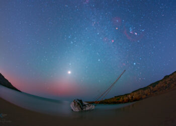 La magia del cielo di inverno nello scatto di Dario Giannobile a Calamosche